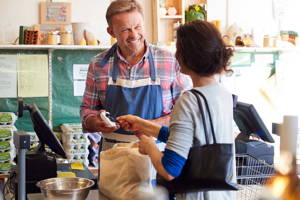 Woman checking out at cash register